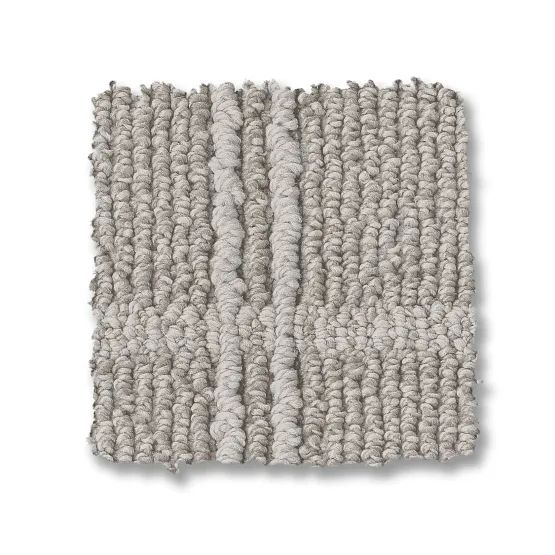 Close-up of a square, textured carpet sample in shades of gray.
