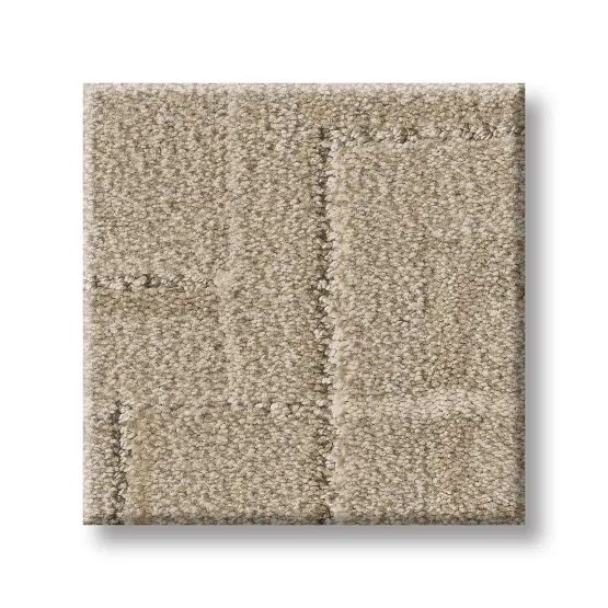 Tan carpet tile with a textured, flecked surface.