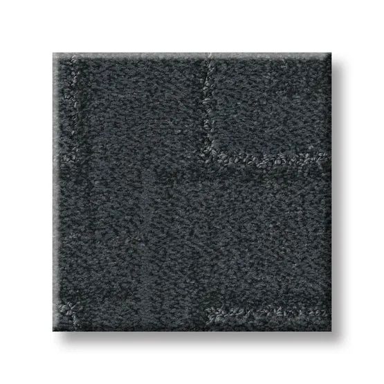 Dark gray square, textured, resembling stone tiles joined together.