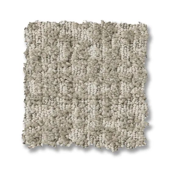 Beige carpet square with looped texture.