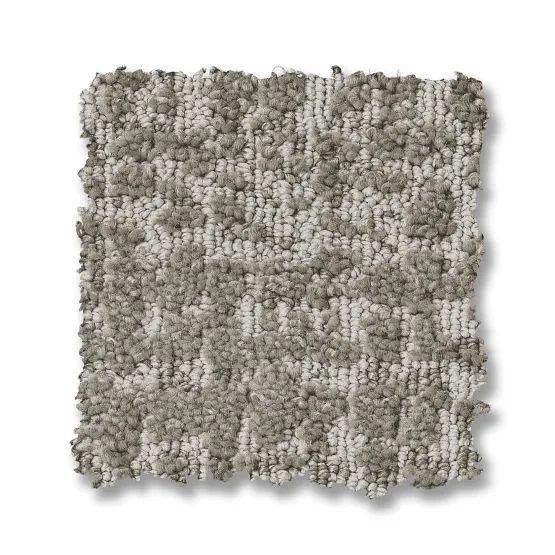 Gray and white patterned carpet sample, showing a textured checkerboard design.