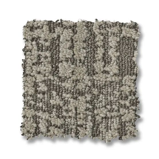 Textured carpet sample, tan and gray, with vertical patterns.