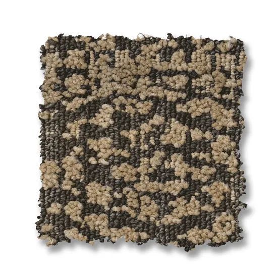 Close-up of a square carpet sample with a speckled pattern of tan and dark brown.