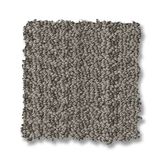 Close-up of a square carpet sample with a speckled gray color and looped texture.