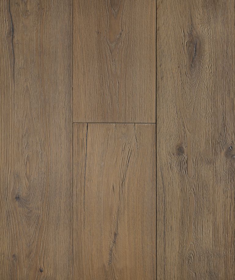 Close-up of weathered, light brown wood flooring planks.