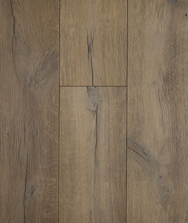 Close-up of weathered, light brown hardwood flooring with visible wood grain and dark accents.
