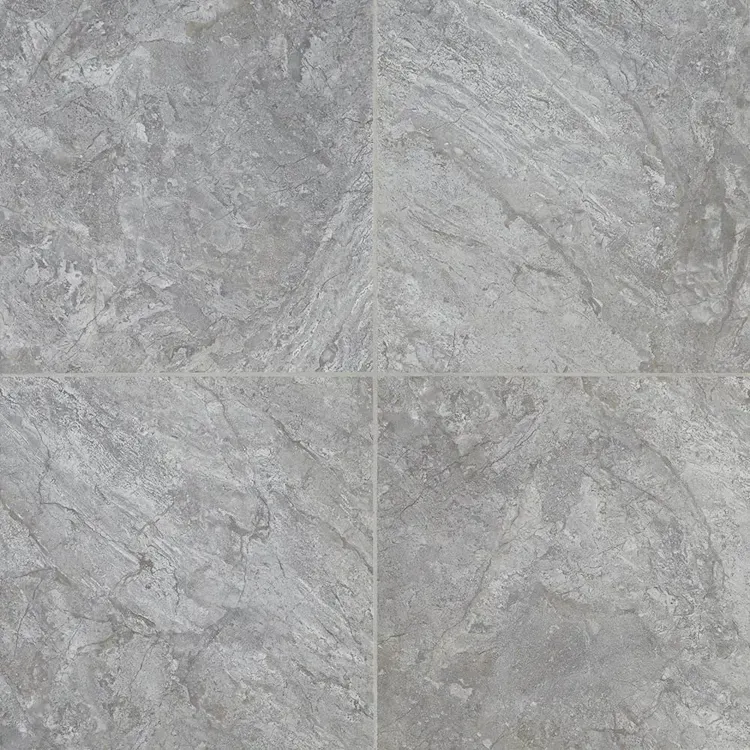Four gray, stone-look tiles arranged in a square pattern, creating a textured surface.