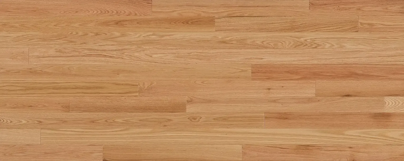 Light brown hardwood floor with horizontal planks.