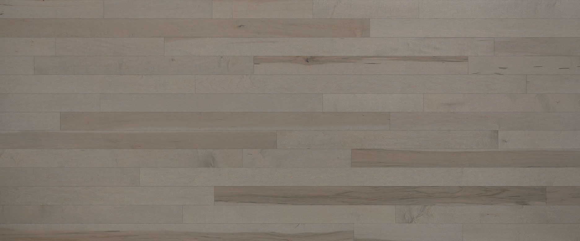 Light-colored wood floor planks, arranged horizontally.