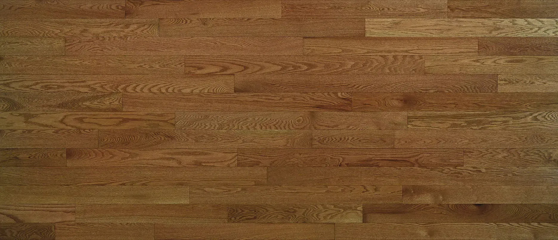 Close-up of a hardwood floor made of brown wooden planks.