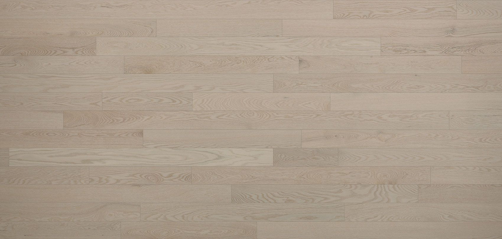 Light-colored hardwood floor planks, a neutral background texture.