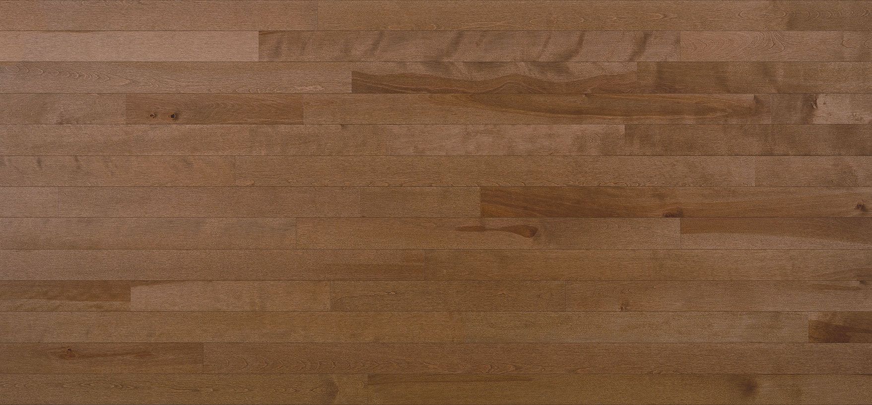 Wooden parquet flooring with a mix of light and dark brown tones.