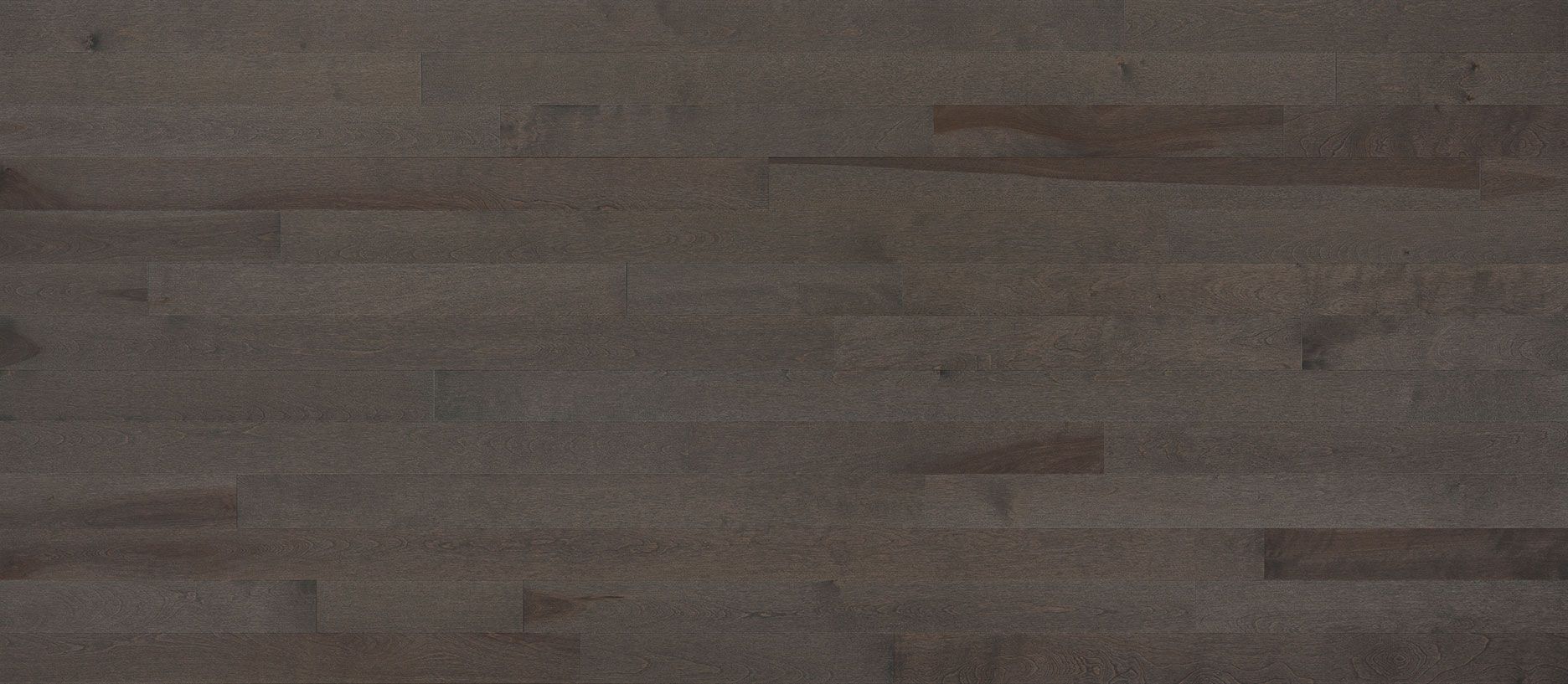 Dark gray wood flooring with visible wood grain and plank seams.