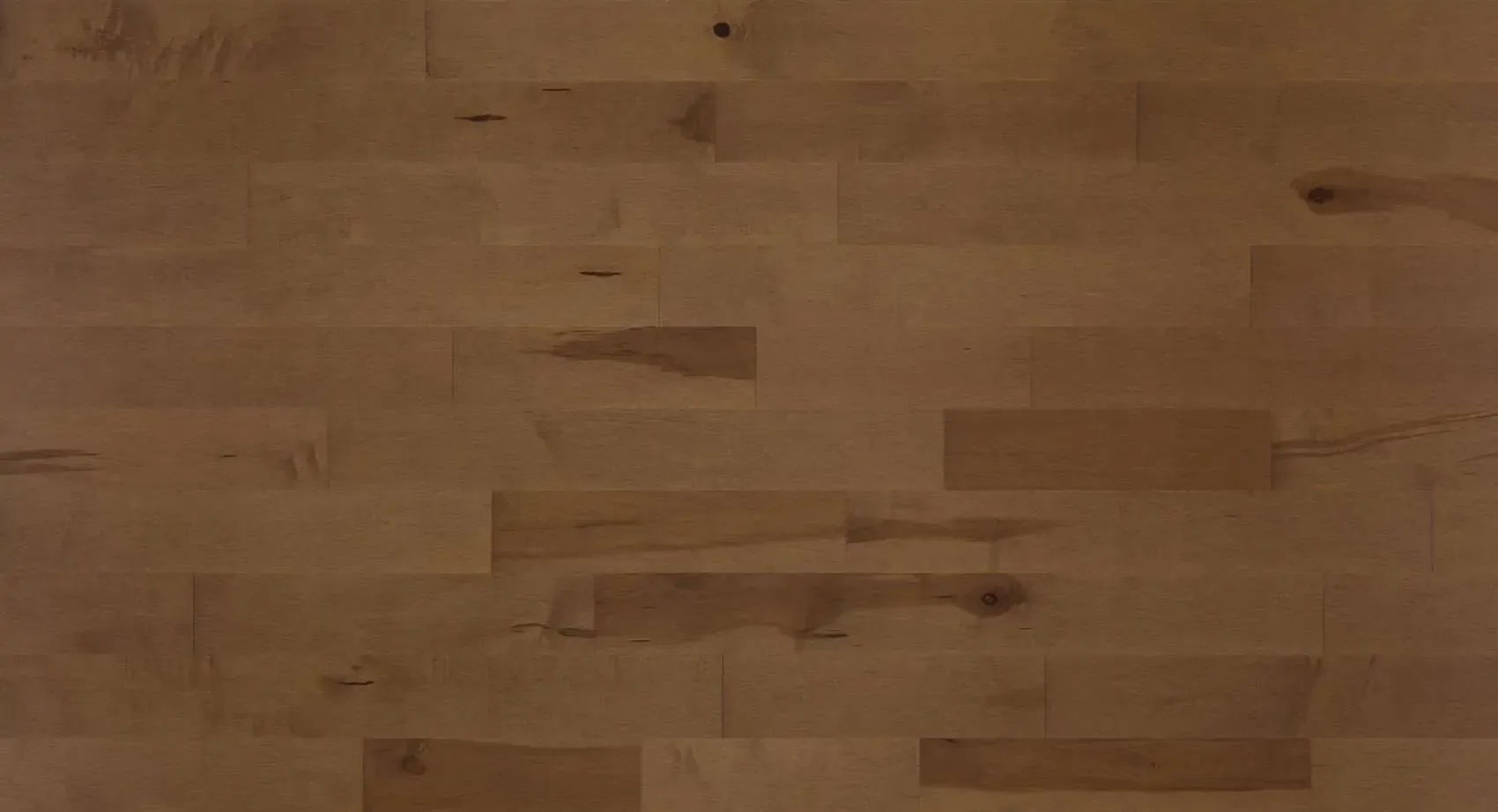 Wooden floor with a light brown finish and a natural wood grain pattern.