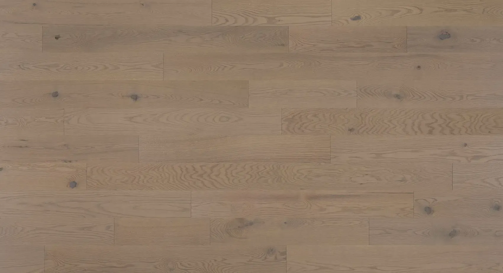 Light brown wood floorboards with subtle grain variations and knot details.