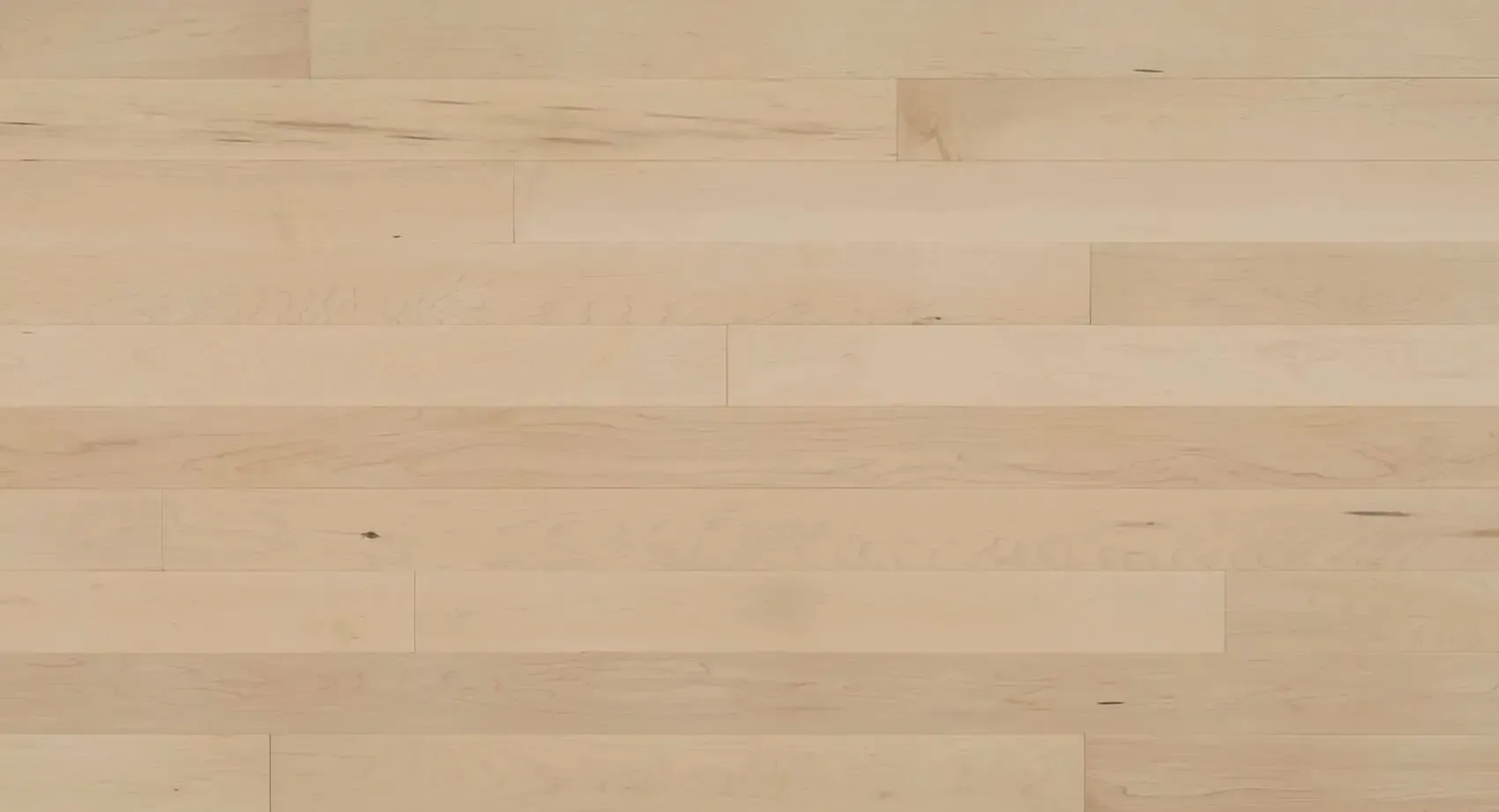 Light-colored wood floor planks, arranged horizontally.