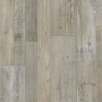 Light gray wood-look flooring with vertical planks, variations in color and grain.