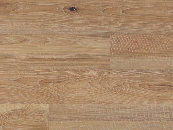 Light-colored wooden flooring planks with a natural wood grain pattern.