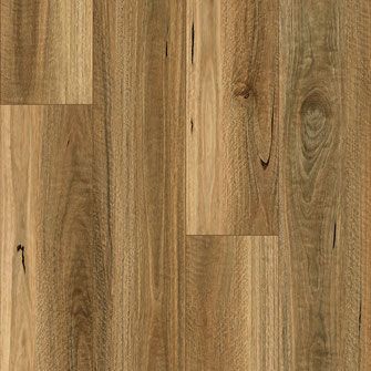 Close-up of wooden flooring with light brown and tan hues, featuring vertical grain patterns.