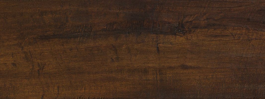 Dark brown wood grain background.
