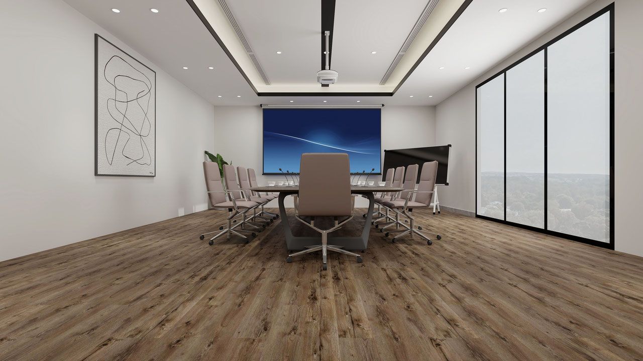 Conference room with long table, chairs, and projection screen. Wood flooring and large windows.