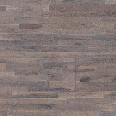 Wood flooring in varying shades of brown, with a textured, weathered appearance.