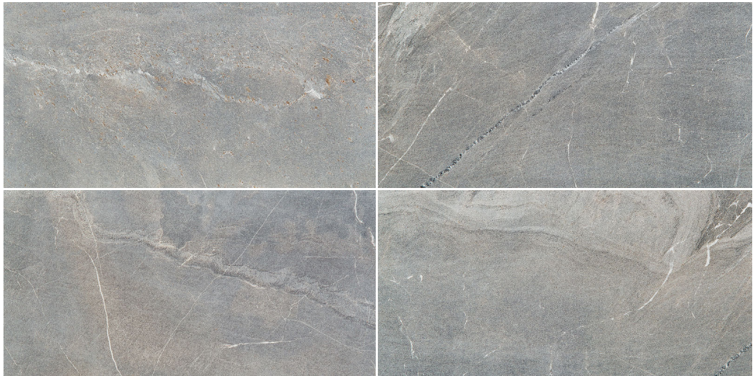 Four gray stone tiles arranged in a square.