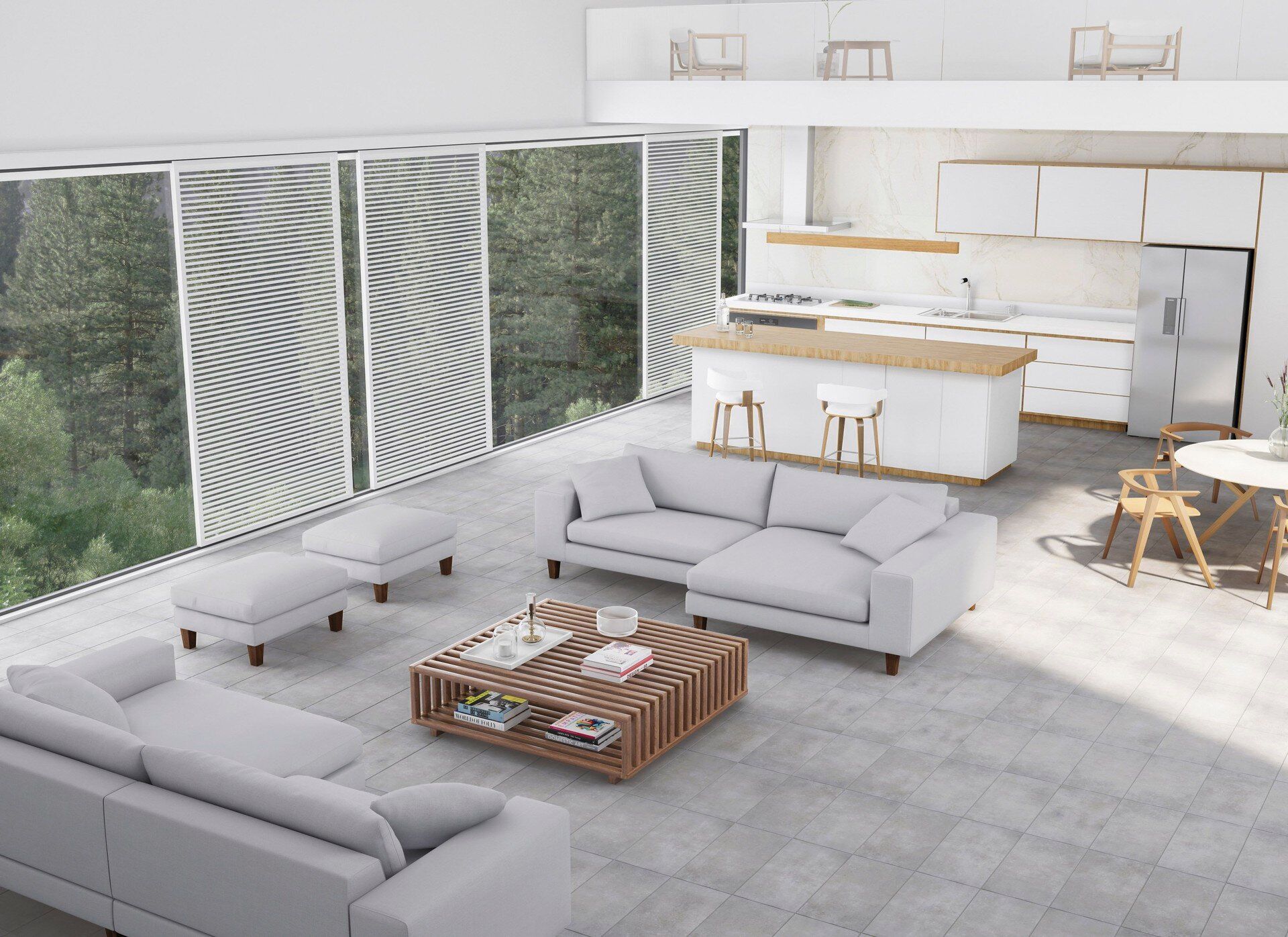 Modern open-plan living space with white furniture, kitchen, and large windows overlooking trees.