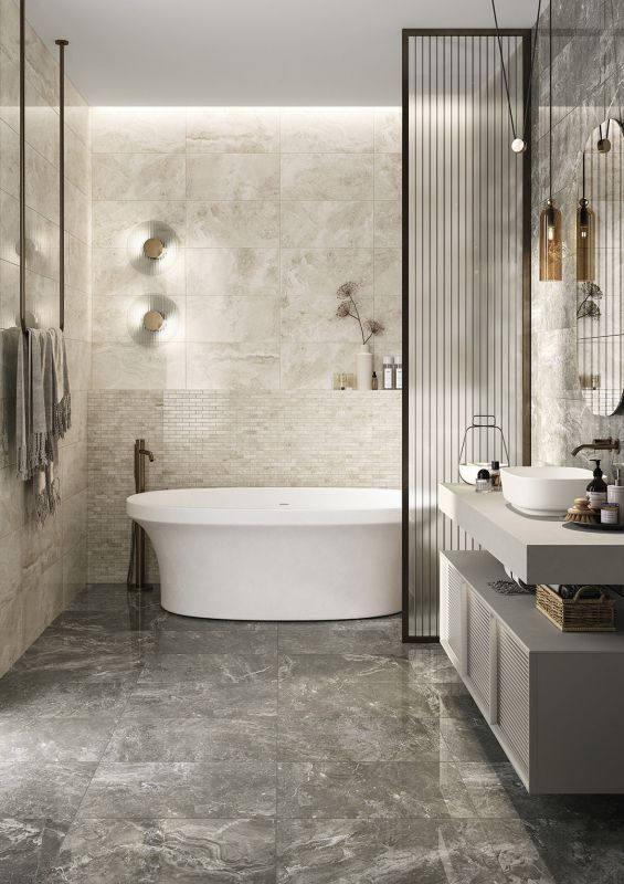 Modern bathroom with freestanding tub, gray marble floor, neutral walls, and vanity.
