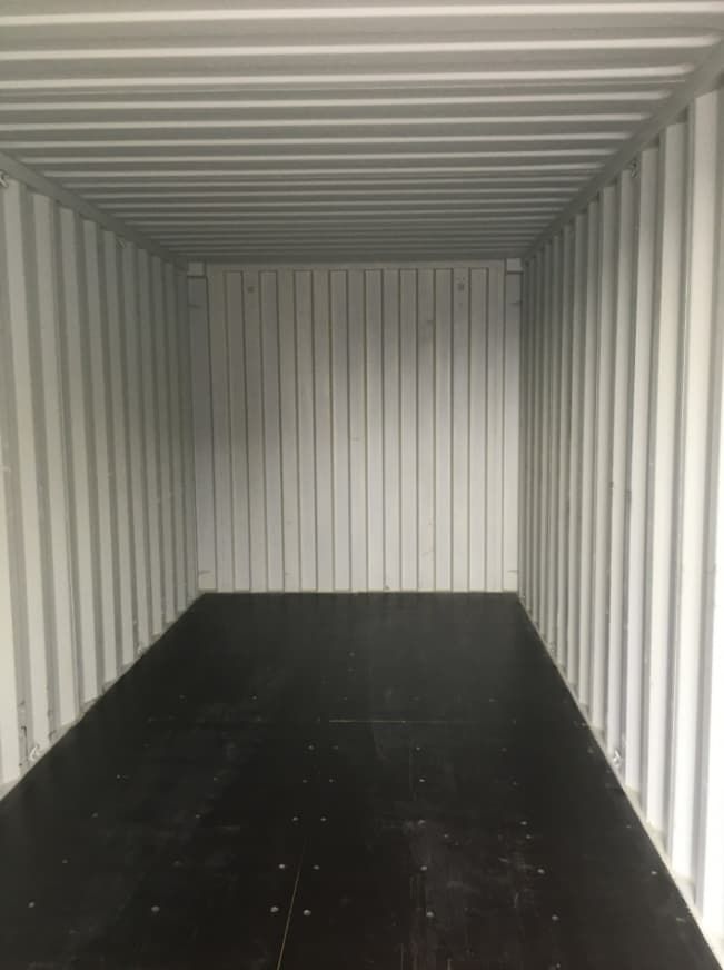 An Empty Shipping Container With a Black Floor and White Walls — Toowoomba Container Hire & Sales in Wilsonton, QLD