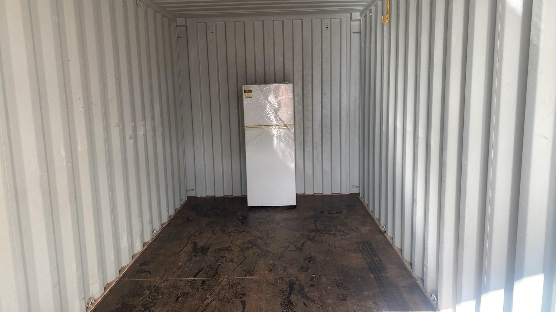 A Large Shipping Container is Parked in Front of a Building — Toowoomba Container Hire & Sales in Wilsonton, QLD