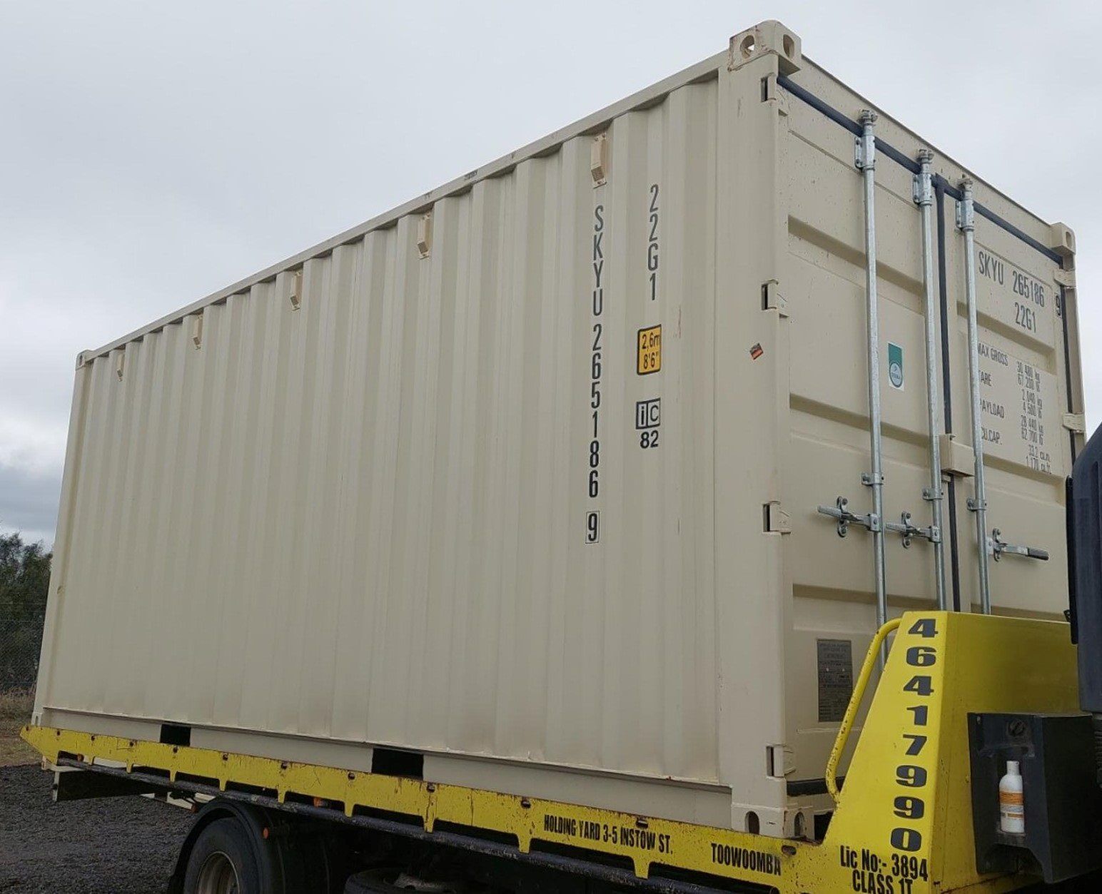 A Large Shipping Container is Being Towed by a Tow Truck — Toowoomba Container Hire & Sales in Wilsonton, QLD
