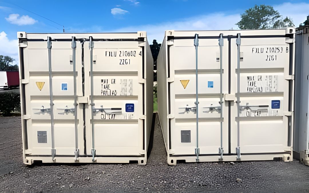 Two White Shipping Containers Are Sitting Next to Each Other in a Parking Lot — Toowoomba Container Hire & Sales in Wilsonton, QLD