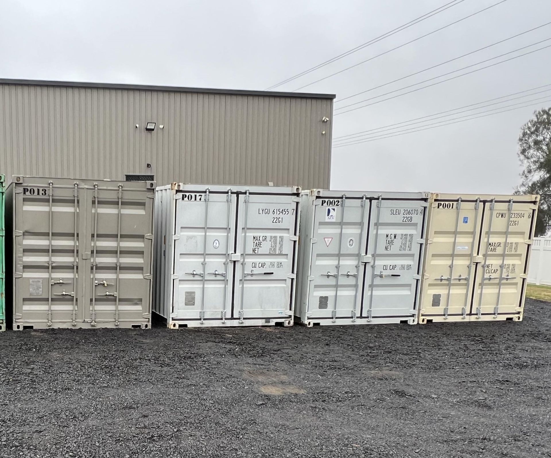 A Tow Truck is Carrying a Container on the Back of It — Toowoomba Container Hire & Sales in Wilsonton, QLD