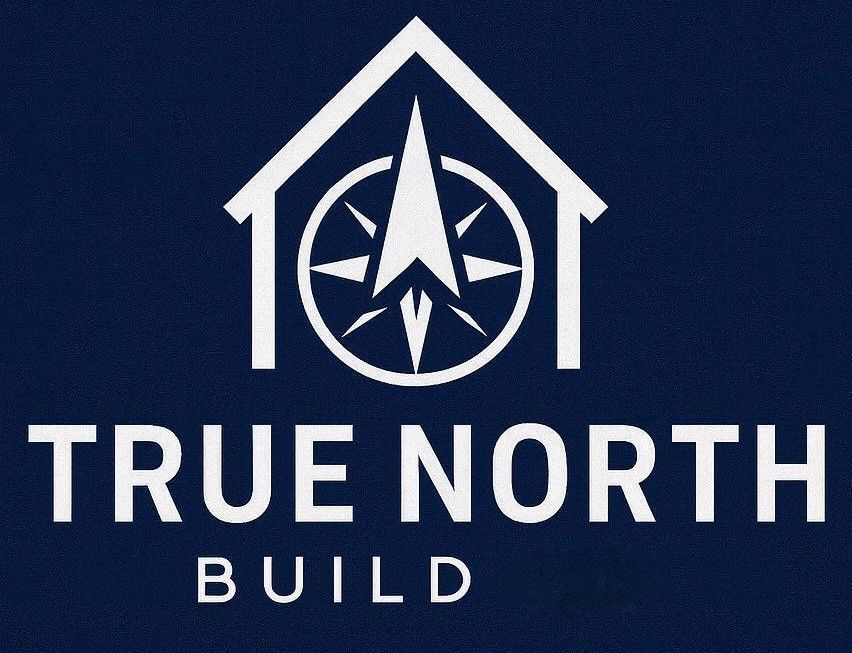 Logo for True North Build featuring a white house outline containing a compass pointing north on a dark blue background.