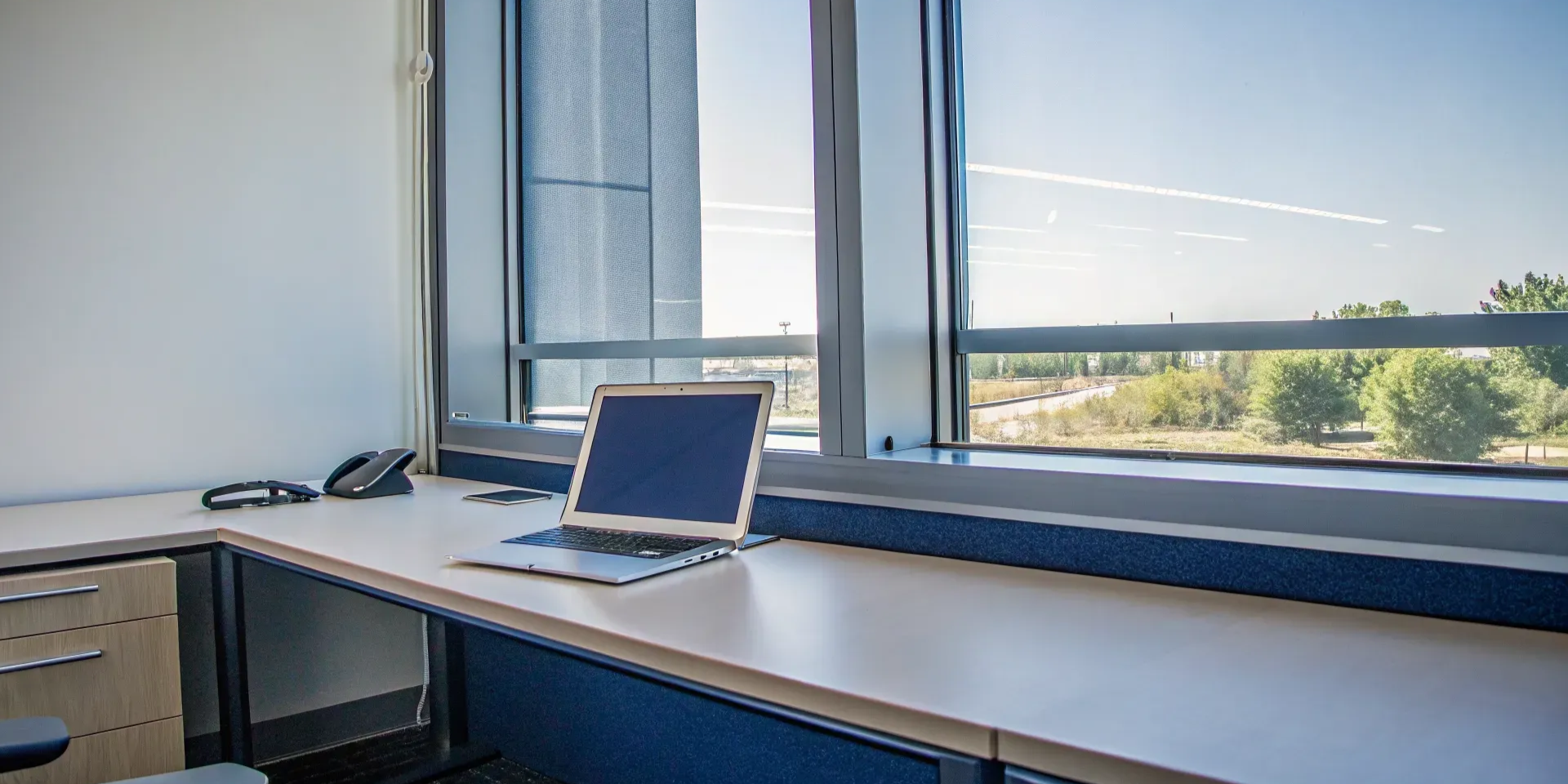 Using a solar savings calculator on a laptop in a modern Wichita office.