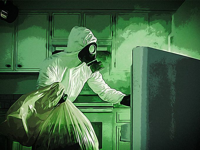man wearing bio hazard suit and gas mask