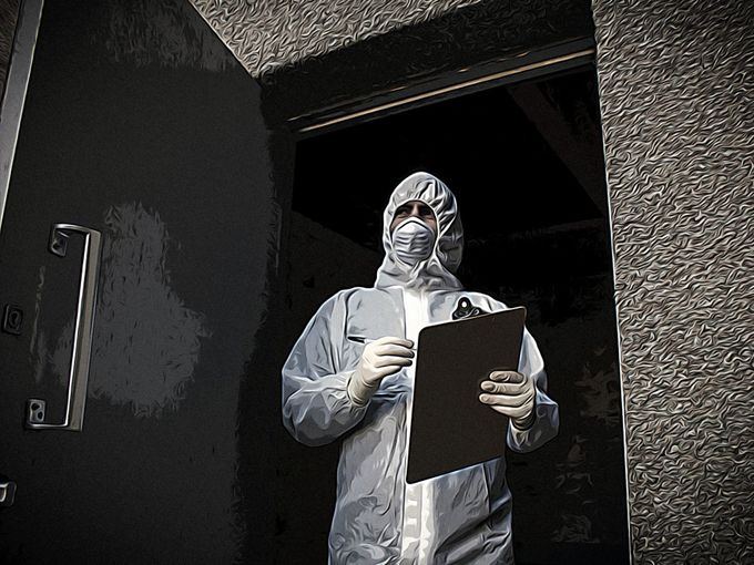 man wearing bio hazard suit and face mask standing in door way holding a clip board