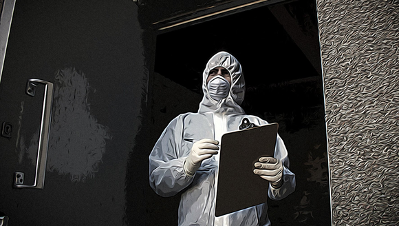 man in biohazard suite writing on a clipboard