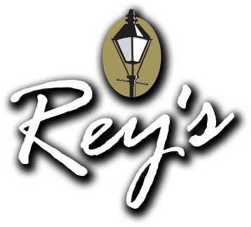 A logo for rey 's with a lamp post in the center