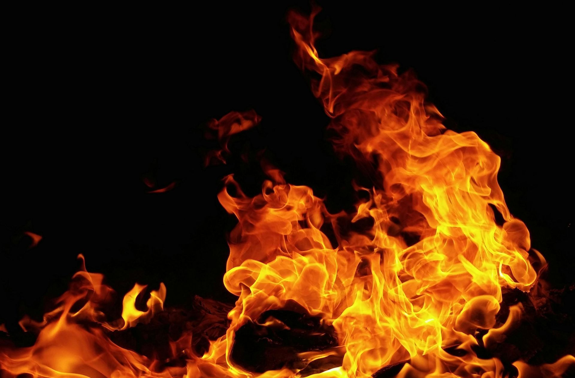 A close up of a fire on a black background.