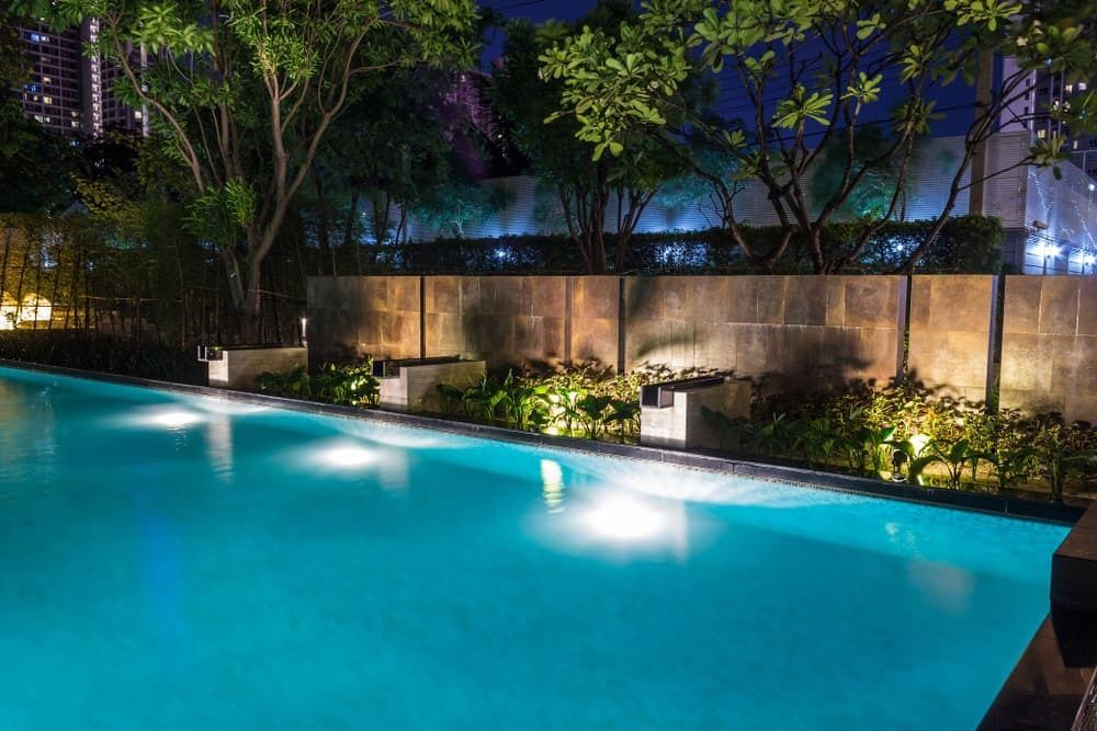 An Illuminated Swimming Pool at Night — A Betta Fence 'N' Yard In Port Macquarie, NSW