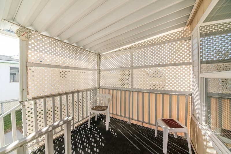 A Covered Porch With White Lattice Walls — A Betta Fence 'N' Yard In Port Macquarie, NSW