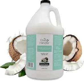 White jug of Coco Handlers coconut shampoo with coconut halves behind it