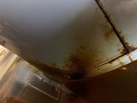 sign of leaking water heater on the bottom of heater