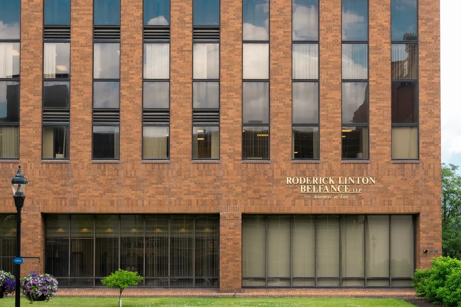 A brick building with the name roderick linton reliance on it