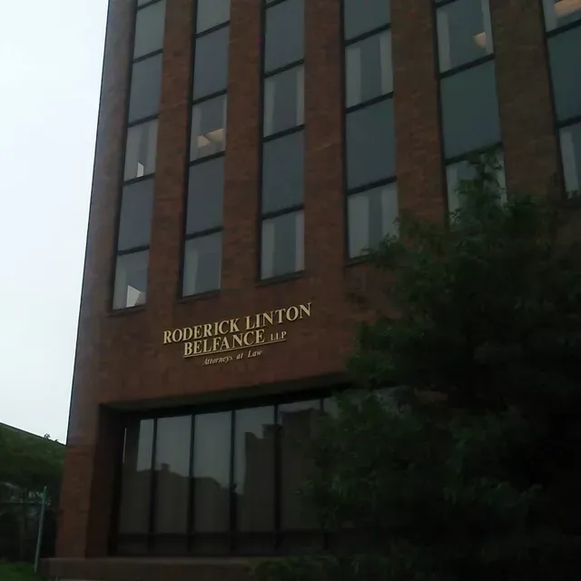 A brick building with the name roderick linton reliance on it