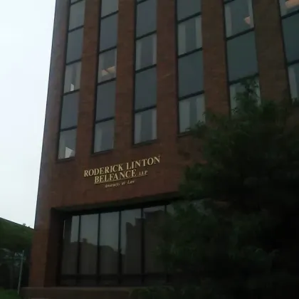 A brick building with the name roderick linton reliance on it