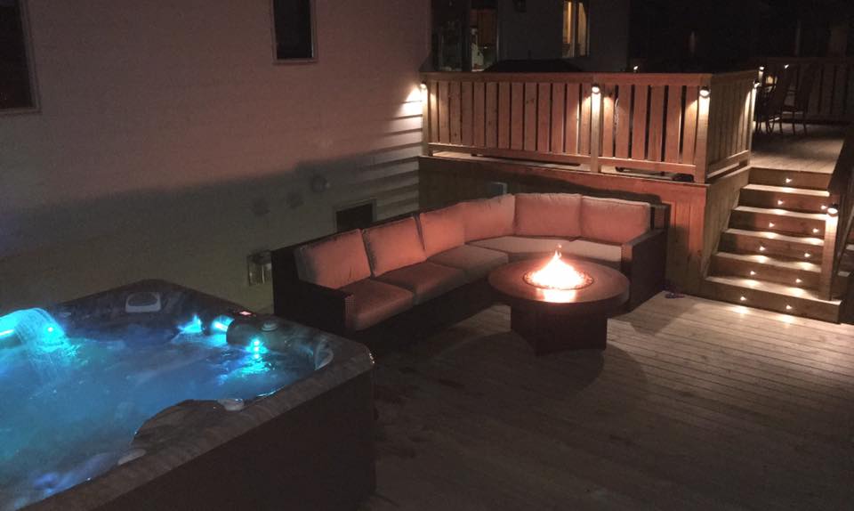 night outdoor furniture with fire pit and hot tub spa