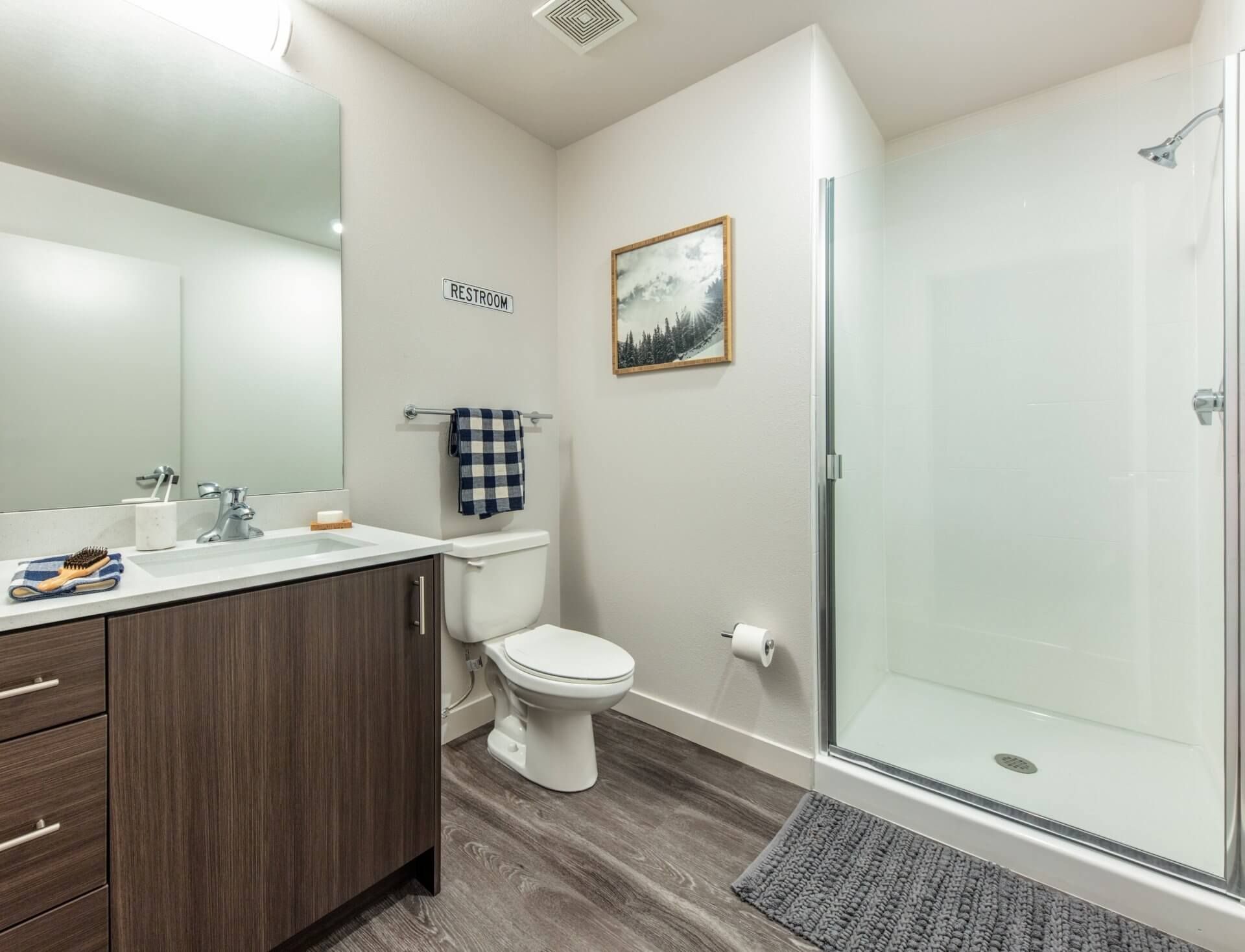 Designer Bathrooms w/ Glass Shower Doors at Identity Boise.